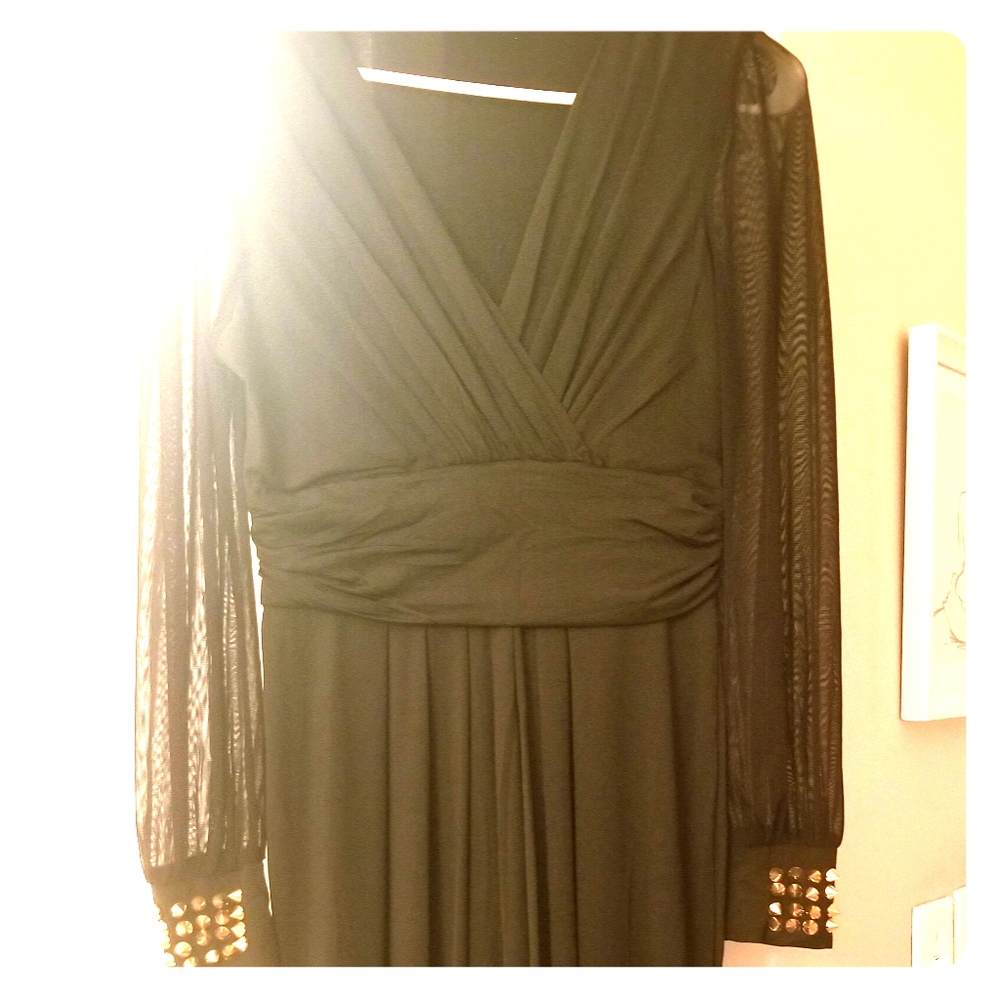 Lovely one piece outfit. Black, never worn.